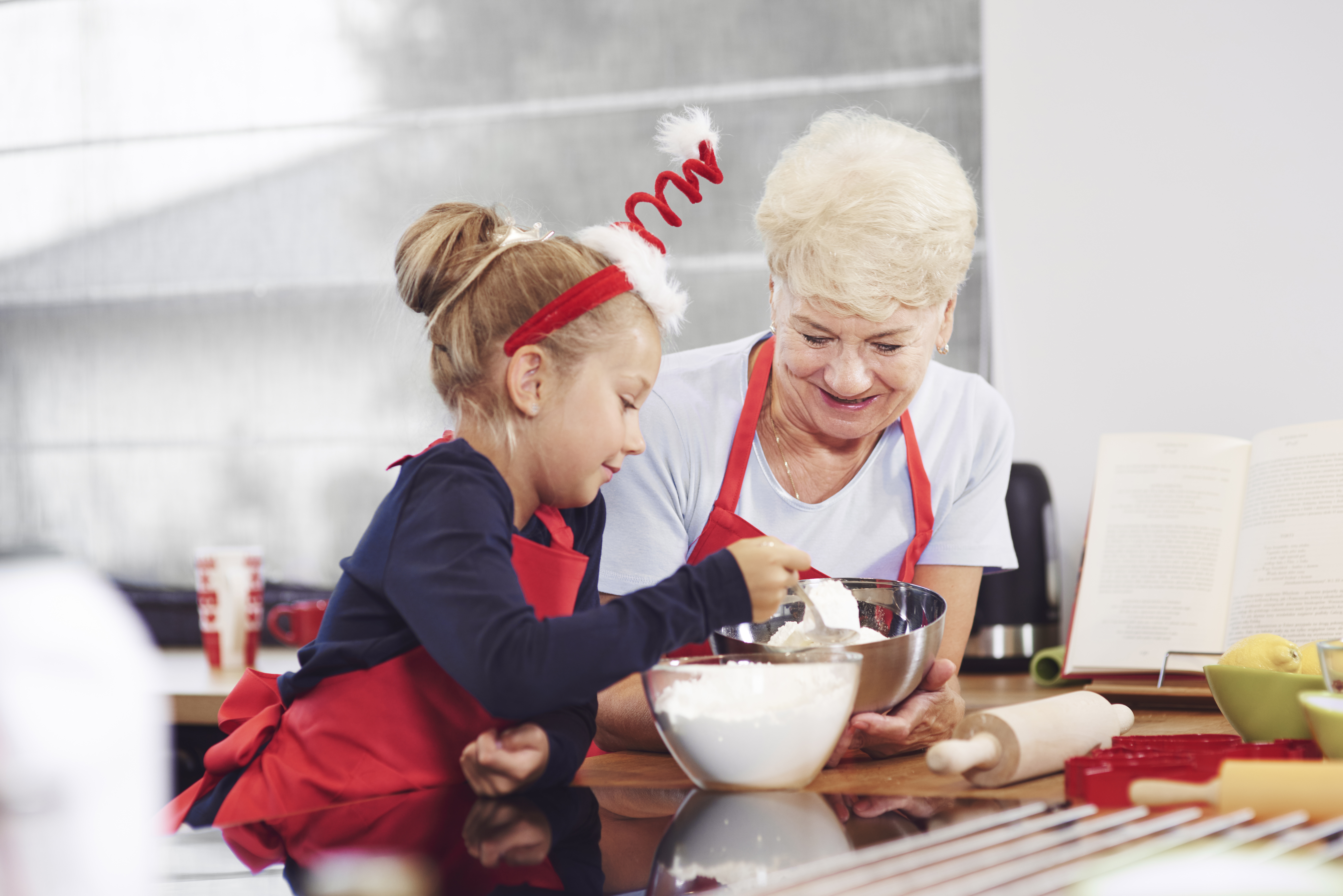 grandma-teaching-her-grandchild-how-make-cake.jpg